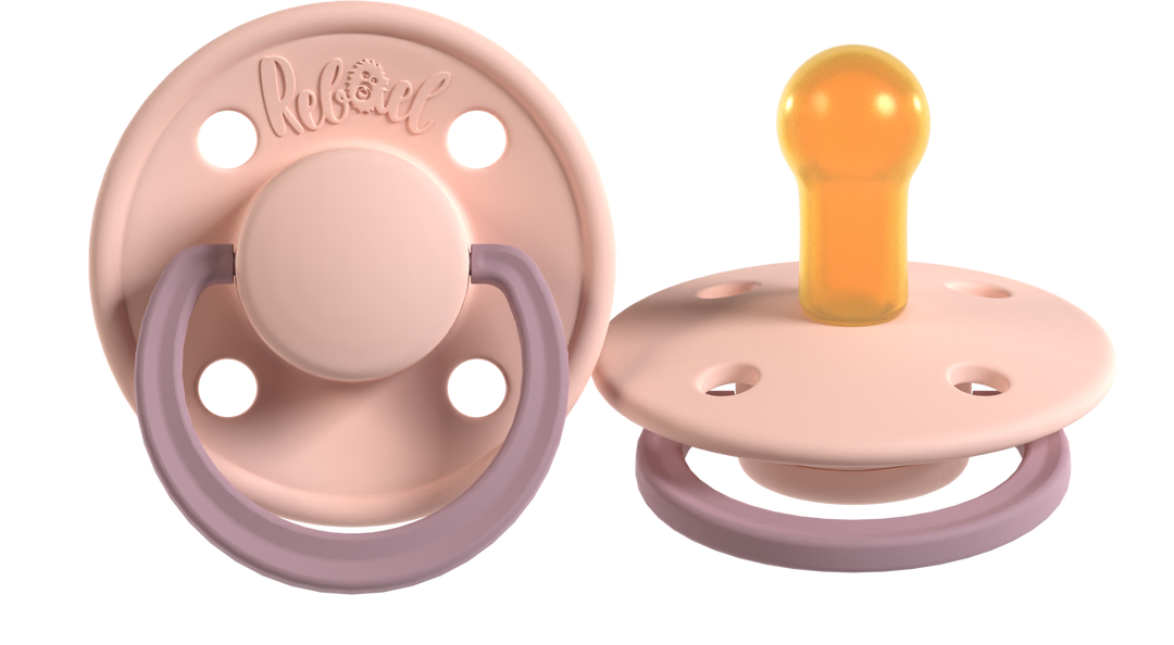 Two pacifiers with purple and pink