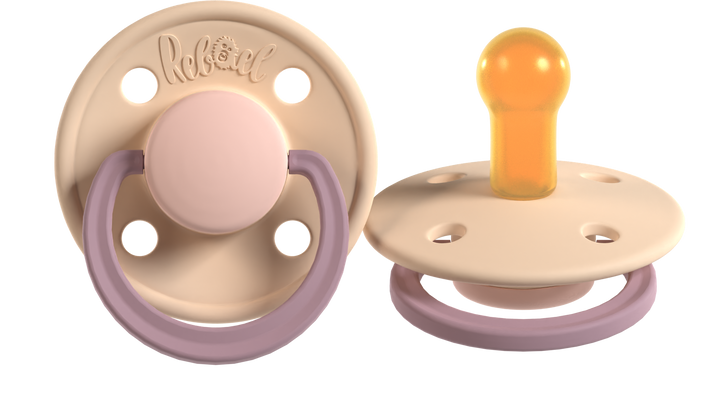 Two baby pacifiers with different designs on a white background
