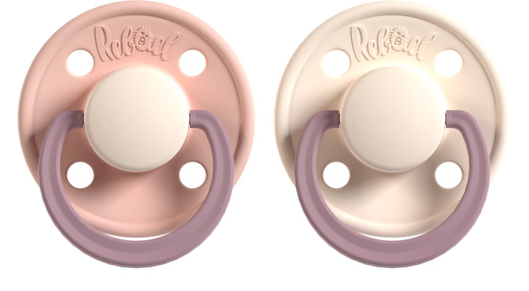 Two baby pacifiers with pink and beige 