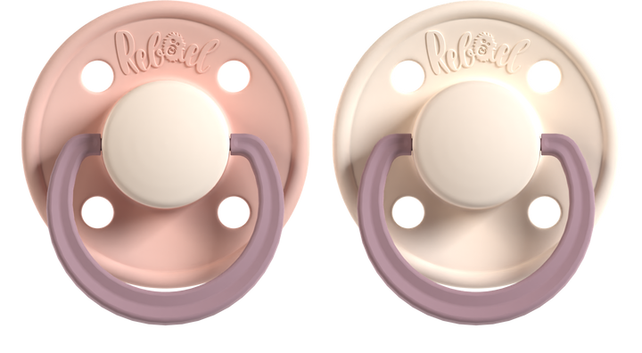 Two baby pacifiers with pink and beige 